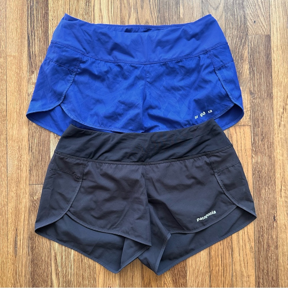 Two pairs of small Patagonia Strider women’s 3” running shorts. Blue & black